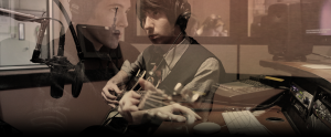 artistic overlap of photos, one shows a person playing the guitar in the sva recording studio overlapped over another person also in the recording studio working on a keyboard.