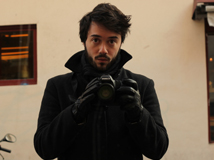 Self photo from alumnus Rob Kolodny using a DSLR camera, while dressed in all black with black leather gloves on.