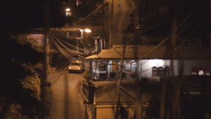 Screenshot of Maya's film showing a car driving along a road at night