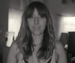Profile Photo of BFA Film faculty memeber CorTney Collins. Black and white photo of woman smiling at camera