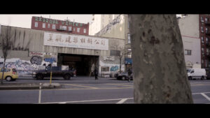 Still from Yoko Chen's short essay film shows outdoor street area in new york city