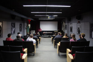the SVA 5th floor screening room packed with students looking at a blank screen