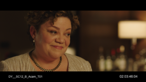 A still from Daniel's film shows Sol Miranda in a scene at a rehearsal dinner smiling at someone off camera.