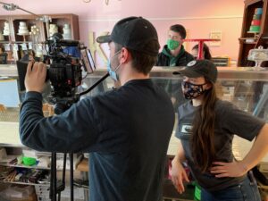 Behind the scenes of Annie with her Director of Photography inside a bakery.