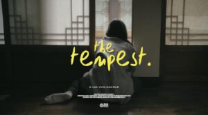 Poster for Julie Jangs film The Tempest shows a person leaning up against a window from behind.