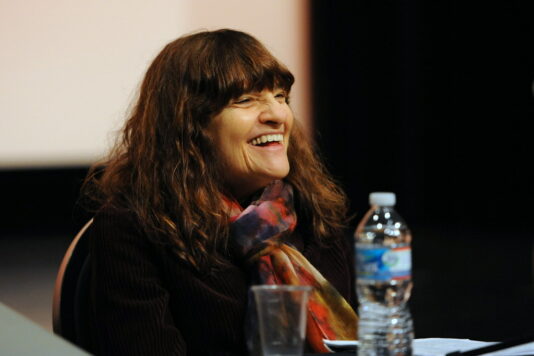 Film Critic Amy Taubin in a meidum shot at a film panel