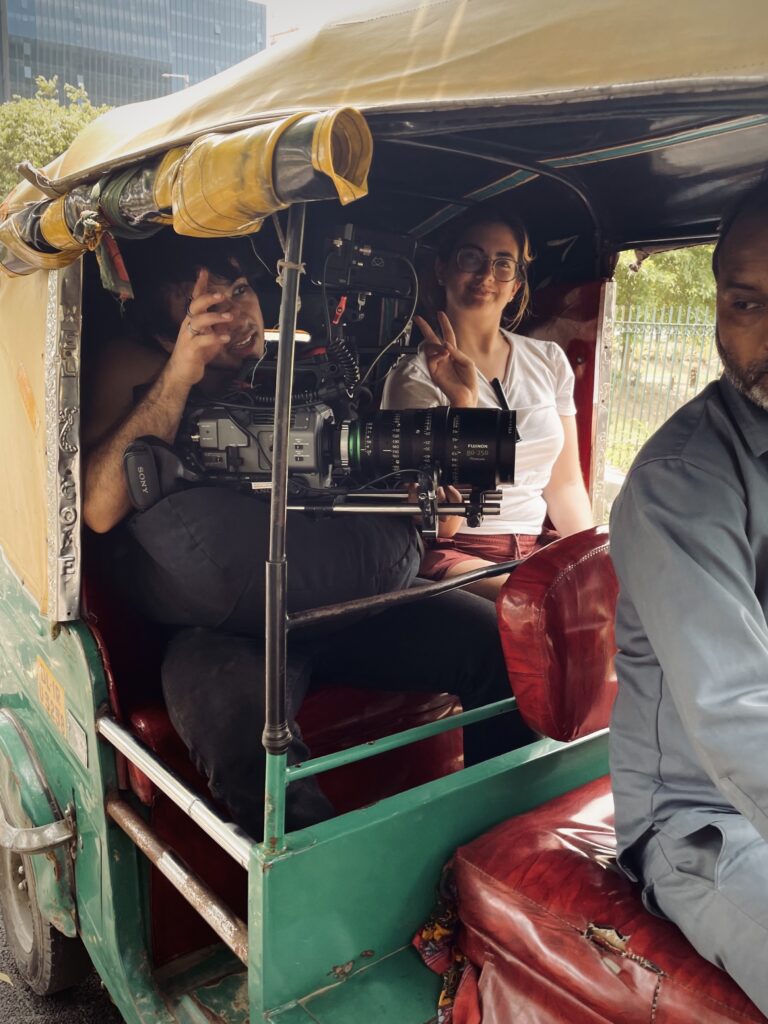 The Subah crew films outside in a cart.