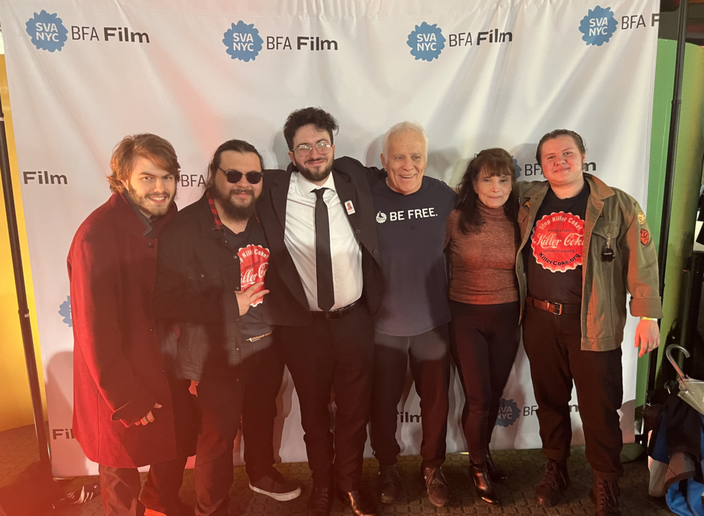Kenny, Ray, and the rest of the crew at the 2023 Thesis Showcase event. All standing in front of a step and repeat for the BFA Film department!