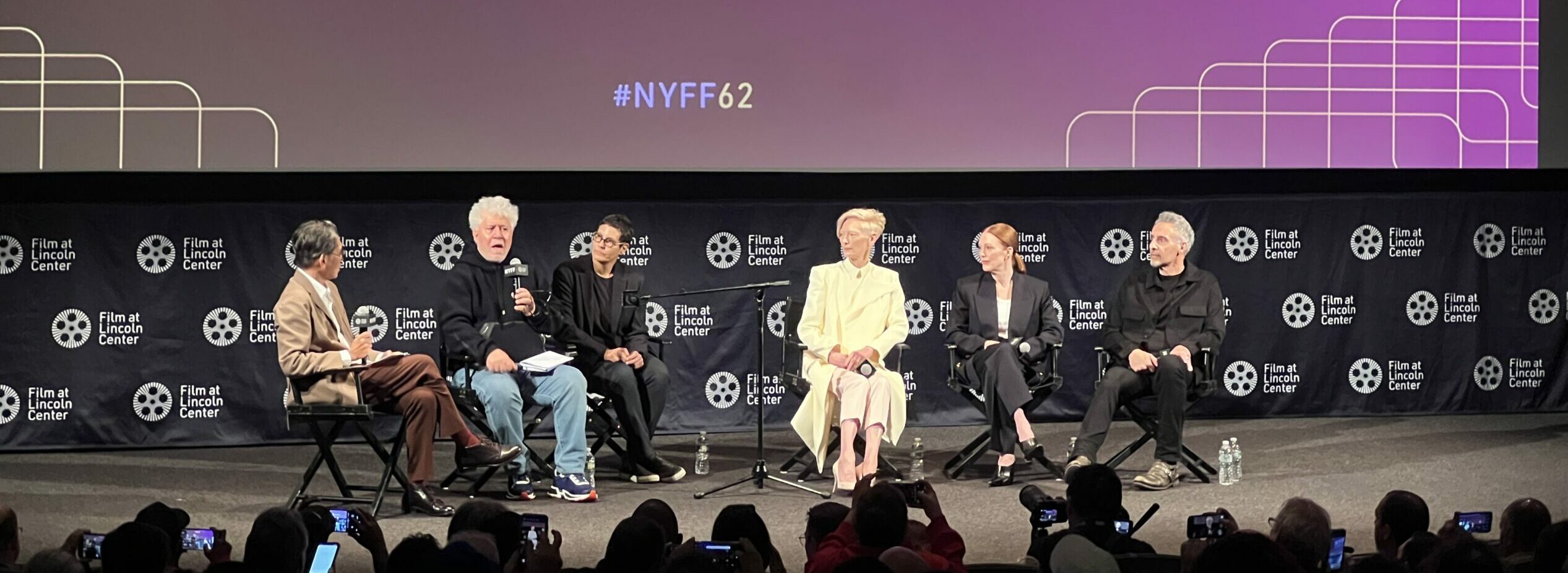 New York Film Festival premiere of Pedro Almodovar's film The Room NExt Door stage featuring Pedro on stage with Tilda Swinton, Julianne Moore, and John Tuturro with Dennis Lim.